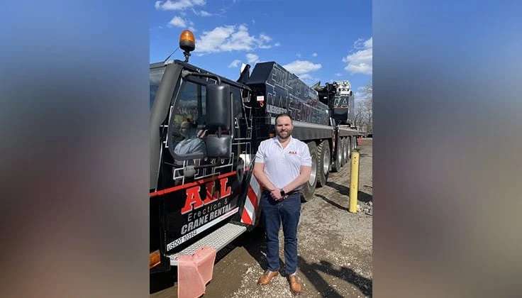 Josh Bacci in front of a truck