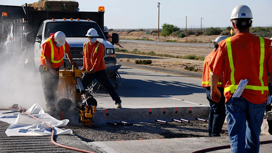 Construction workers on a road project