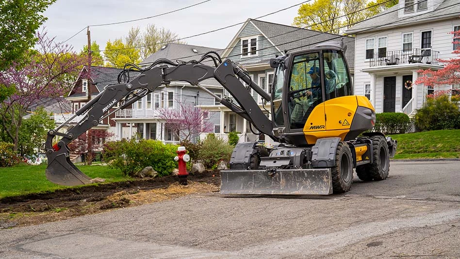 An excavator digging into the earth.