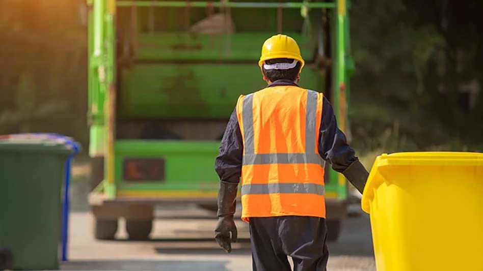 Worker collecting waste