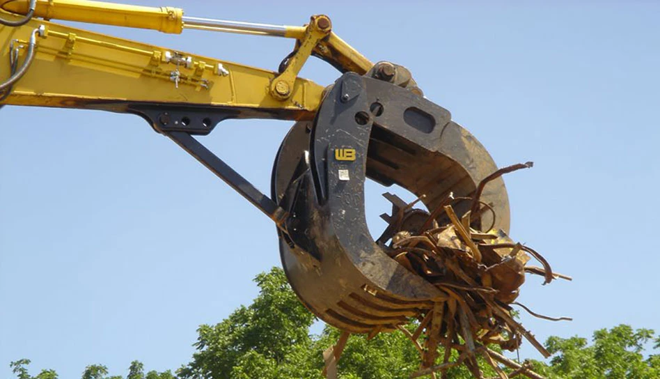 a box grapple lifting debris